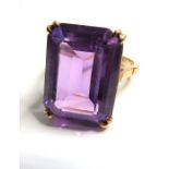 A 9-carat gold ring set with emerald-cut amethyst (7.26g) (The cost of UK postage via Royal Mail