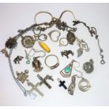 An interesting selection of mostly silver pendants and associated costume jewellery (The cost of