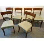 A set of six early 19th century mahogany dining chairs; each with concave bar back style toprail,