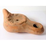 A Roman terracotta oil lamp, possibly 3rd/4th century