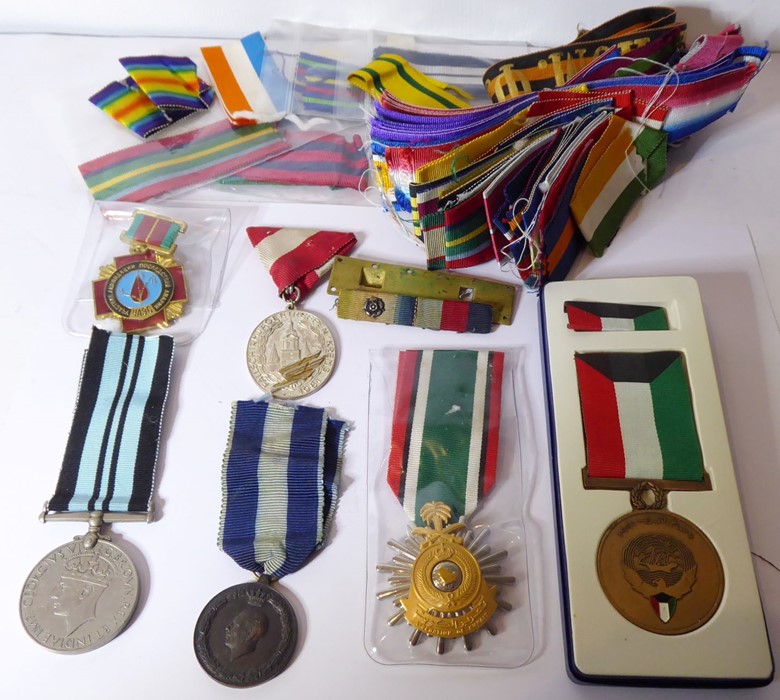 An assortment of six medals together with a large collection of medal ribbons: the Greek