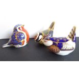 Three Royal Crown Derby paperweights modelled as small birds to include a blue tit and a wren