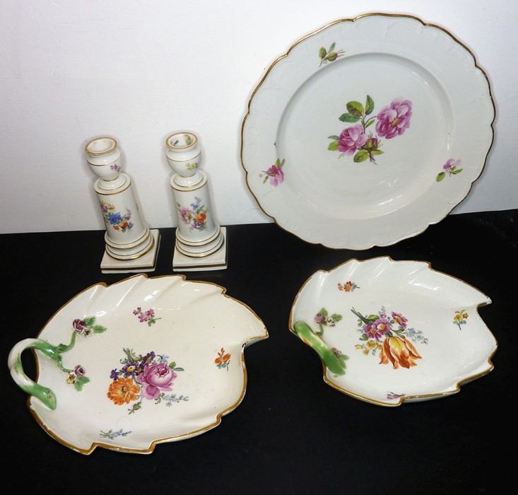 Two graduated leaf-form dishes (21cm and 19cm) and a pair of candlesticks (14cm high), each piece