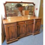 A mid-19th century mahogany pedestal sideboard; the mirrored back above a thumbnail-moulded top