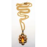 A 9-carat gold citrine pendant and chain (8g) (The cost of UK postage via Royal Mail Special