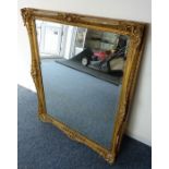 A gilt-framed wall-hanging looking glass (frame size 89cm x 74.5cm)