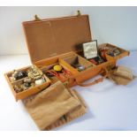 An assortment of costume jewellery within a tan-leather Asprey's jewellery case (The cost of UK