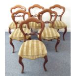 A set of six mid-19th century walnut balloon-back chairs; scrolling crest rails, overstuffed seats
