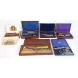 Five late 19th/early 20th century rosewood and mahogany draughtsman's drawing instrument sets