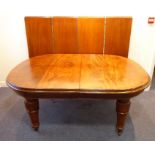 A large 19th century extending mahogany dining table having four extra leaves; moulded edge top