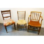 A George III period mahogany open armchair in Sheraton style with saddle seat and square tapering