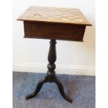An unusual 19th century tripod table, the chessboard top folding to reveal a compartmentalised