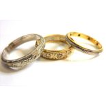 An 18-carat gold eternity ring together with two other eternity rings (3) (The cost of UK postage