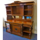 A late 19th century Aesthetic Movement mahogany sideboard; the shelved superstructure with lower