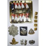 Six British military badges comprising a XCII [92nd] Gordon Highlanders belt badge, four