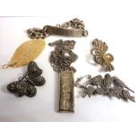 An assortment of mostly silver jewellery etc to include a hallmarked silver ingot and a heavy silver