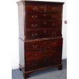 A late 18th century mahogany chest on chest; the outset cornice above two half-width and six full-