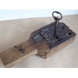 A large 18th century lock mechanism with working action, original fittings and key (38cm long