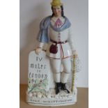 A very rare 19th century Staffordshire figure of 'Dick Whittington', circa 1860/70, coloured and