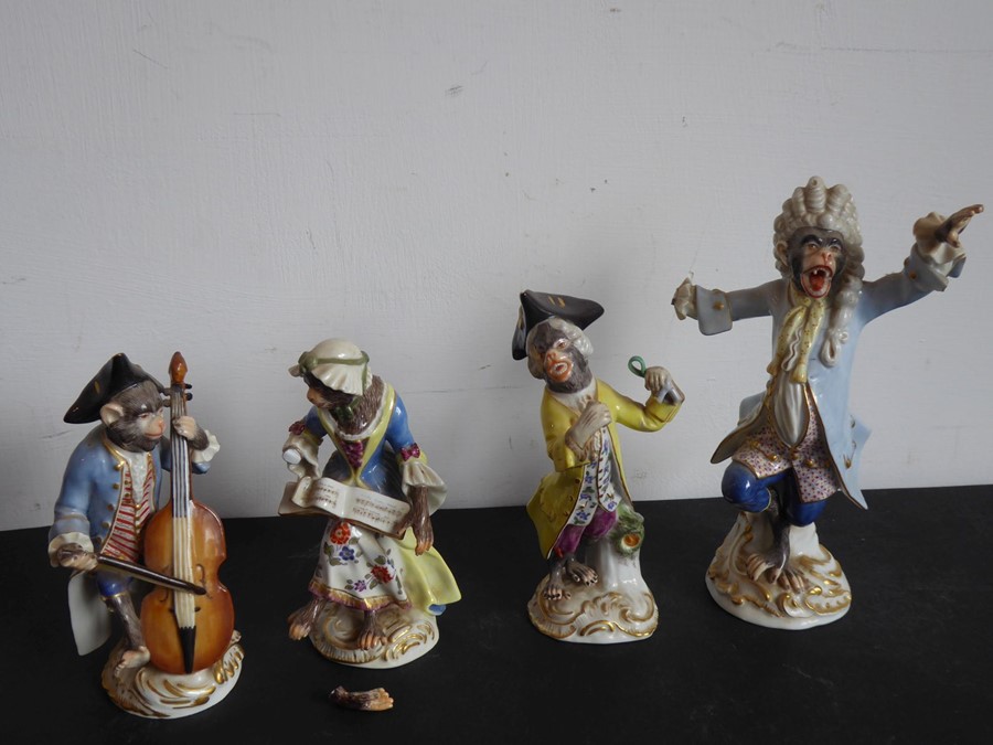 Four hand-decorated 19th century Meissen porcelain monkey band figures (damaged and reparations) (