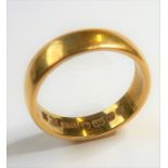 A heavy 18-carat yellow-gold wedding band (gross weight 5.7g)