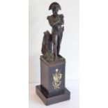 A late 19th/early 20th century patinated bronze sculpture of Napoleon; with arms crossed, his
