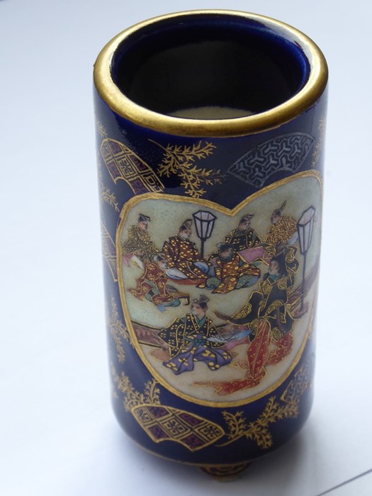 A good and small cylindrical Japanese porcelain spill vase, circa 1900; decorated with two