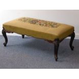 A mid-19th century upholstered long stool; a later floral needlework upholstered top above a