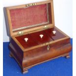 A late 18th century George III period mahogany and chequer-strung bombe-shaped tea caddy; the gilt-