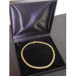 A yellow-metal chain necklace marked '750', boxed (approx. 44cm, approx. weight 30.74g)