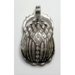 A very heavy 18-carat white-gold 'scarab' pendant set with diamonds and sapphire eyes (18.2g) (The