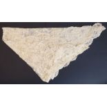 A circa 1890s cream-coloured wedding veil in Brussels lace with floral motifs. Provenance: Worn by