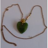 A 9-carat rose-gold neck chain mounted with a green hardstone heart-shaped pendant (probably jade)