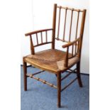 A late 19th century Morris-style Aesthetic Movement wooden armchair having rush seat and turned