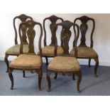 A rare set of five early 18th century green-painted and lacquered salon chairs; each shaped top rail