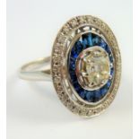 An 18-carat gold sapphire and diamond cluster ring of oval form, the centre diamond 1 carat, ring