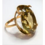 A 9-carat gold ring set with a large citrine; ring size P (total weight approx. 7.4g)  (The cost