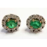 A pair of fine emerald and diamond cluster earrings ((total weight approx. 7.22g) (The cost of UK