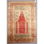 A 19th century Turkish silk prayer rug with red centre point (162cm x 114cm)