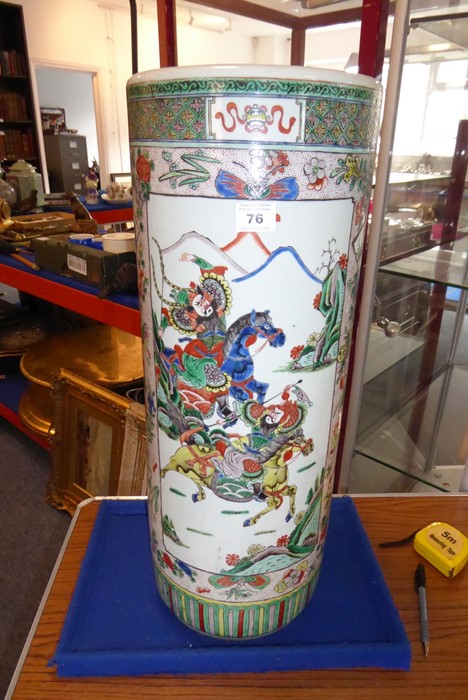 A 19th century Chinese porcelain stick/umbrella stand; the body painted with two main vertical