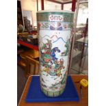 A 19th century Chinese porcelain stick/umbrella stand; the body painted with two main vertical