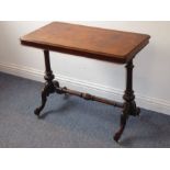 A mid-19th century rectangular figured walnut-topped centre table; two turned supports united by a