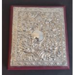 A silver-mounted desk blotter/paper pad; the highly ornate hallmarked silver front with vacant
