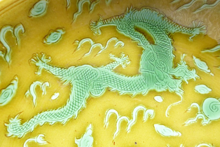 A Chinese porcelain scrafitto dish; three green dragons chasing pearls amongst clouds against an - Image 3 of 9