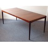 A 20th century extending rosewood dining table by 'Bramin' (Denmark); with central extension leaf