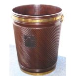 A magnificent over-sized carved hardwood and brass-banded peat bucket made by the Imperial Furniture