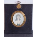 A 19th century oval half-length portrait miniature study of a young lady with long curly dark hair