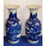 A pair of 19th century Chinese porcelain blue-and-white vases, both with damage to tops but all
