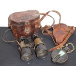 A pair of late 19th century leather-cased field glasses in used condition, together with a brass