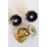 A pair of black-enamel buttons, the reverse is marked GAF 9CT & 18CT, each set with a small white